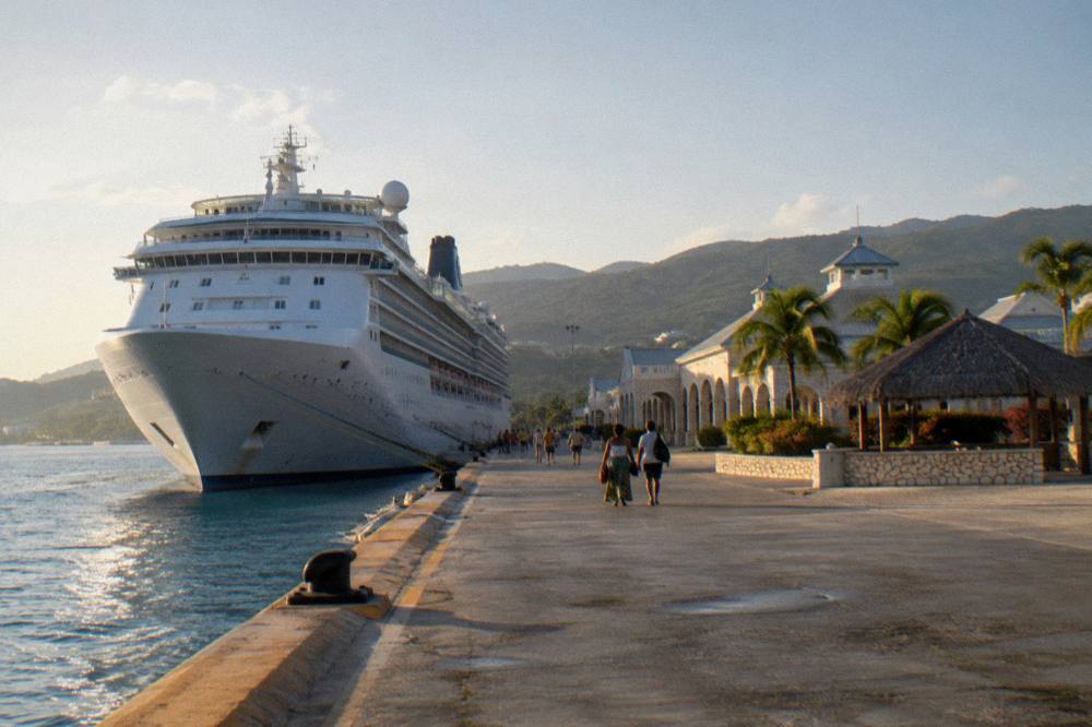 Cruise ship berthed at a pier in late afternoon light