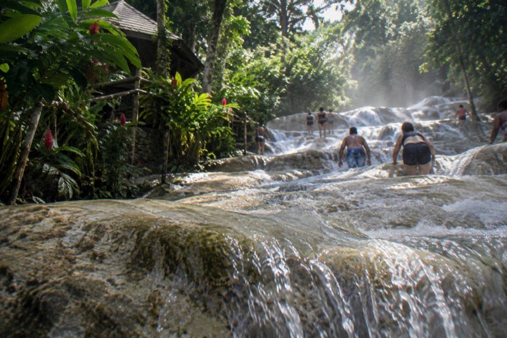 Waterfall terraces surrounded by tropical forest in daylight