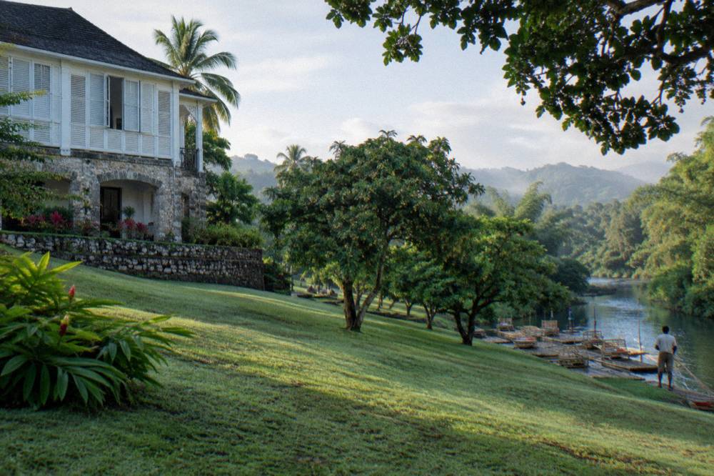 A restored Georgian great house on a green estate above a river valley